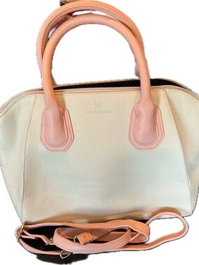 Karla Hanson satchel-style handbag featuring a cream-colored body,pink handles